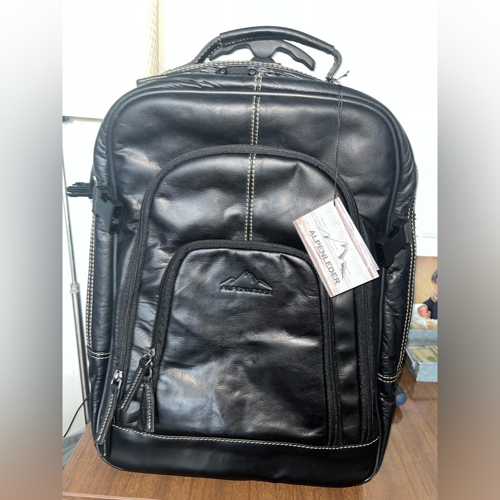 LEATHER BACKPACK WITH ROLL OPTION